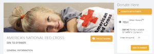 a child lying on a bed with a red cross