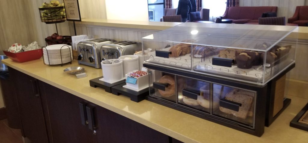 a counter with a variety of pastries