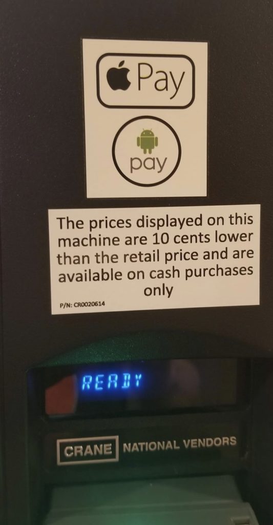 a white and black sign on a machine