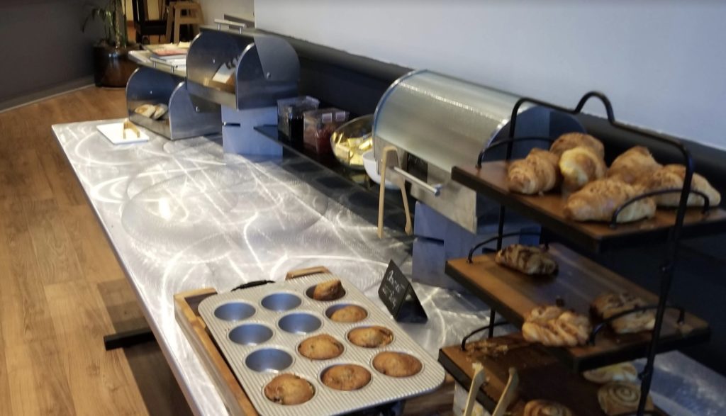 a buffet with pastries and muffins
