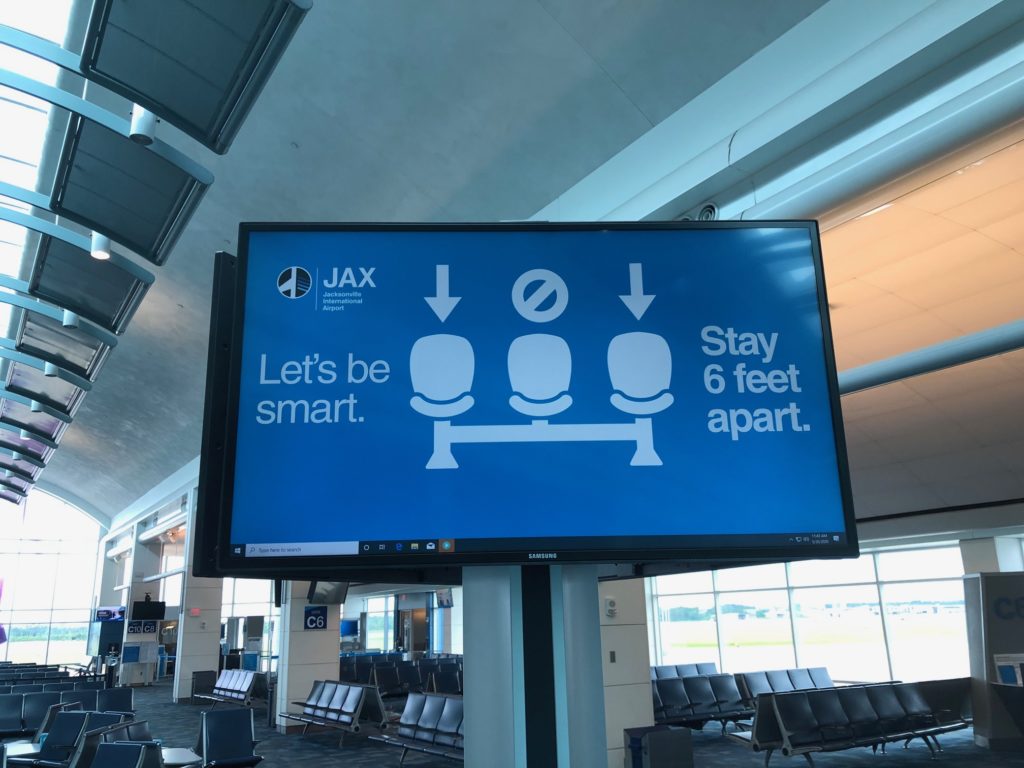 a large screen in an airport