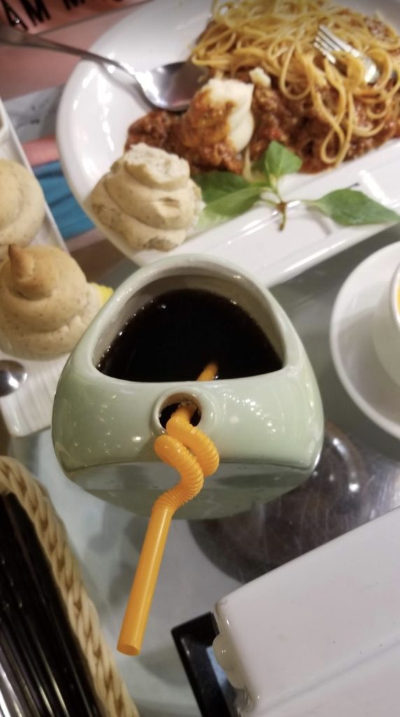 a cup with a straw in it