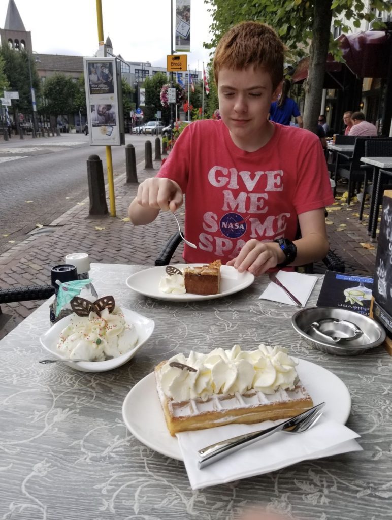 a person eating dessert at a table