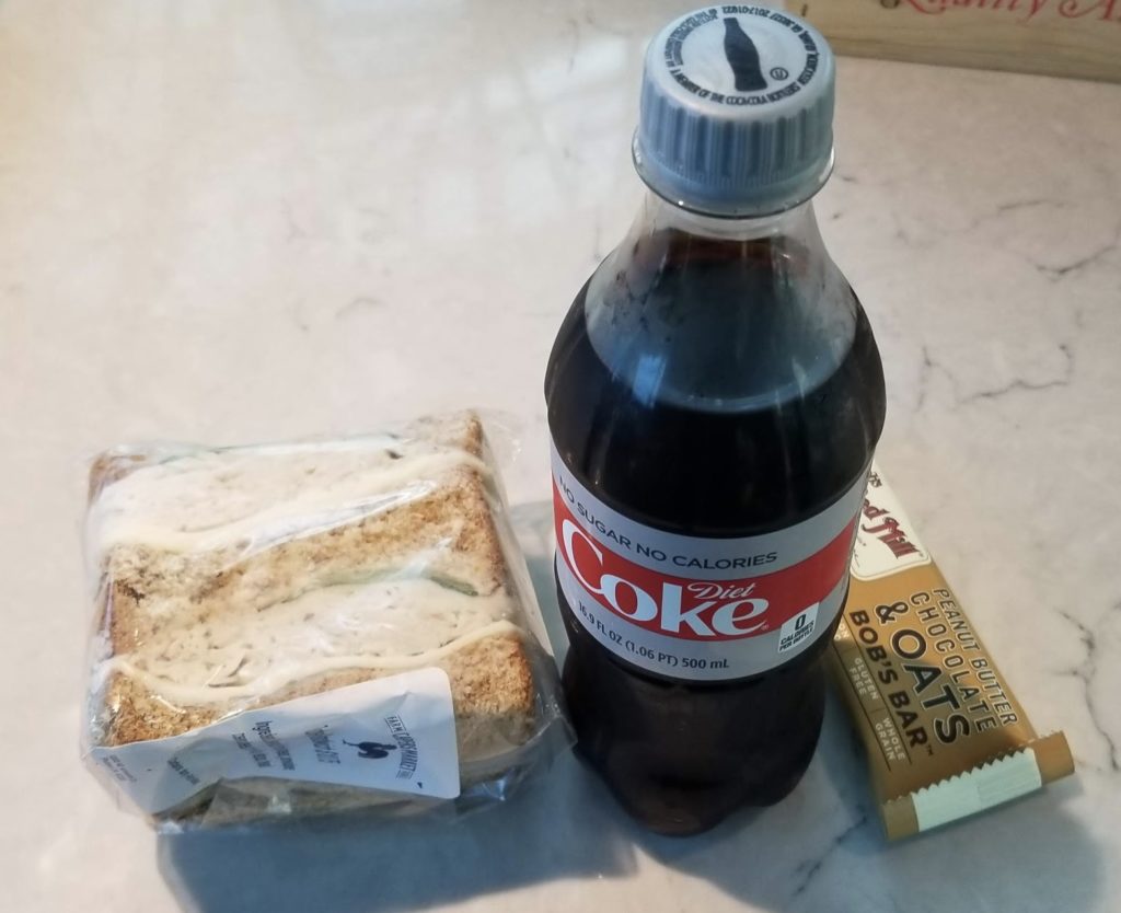 a soda bottle and a sandwich
