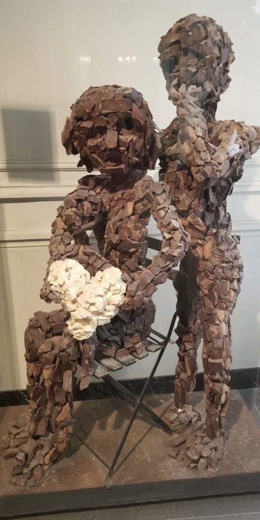 a sculpture of a couple of people
