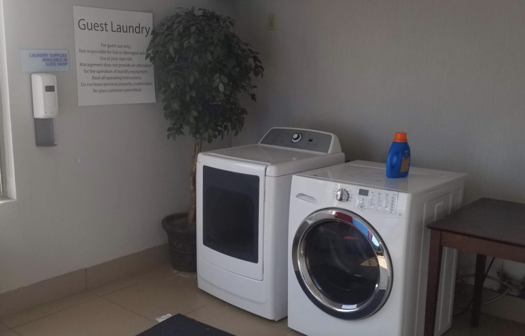a washing machine and dryer in a room