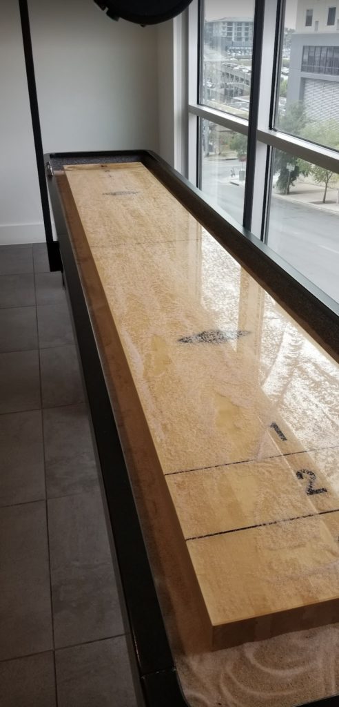 a long wooden table with numbers on it