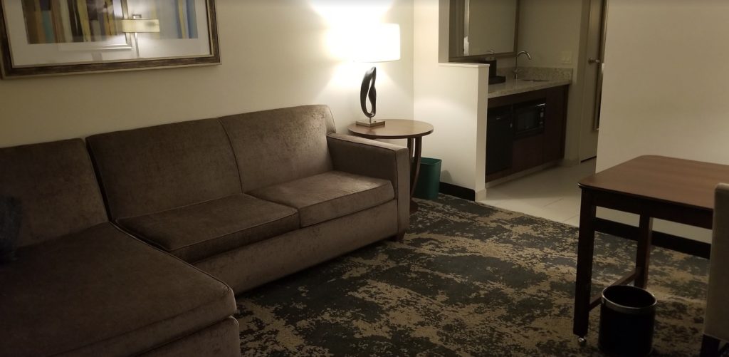 a couch and a lamp in a room