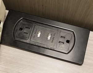 a black electrical outlet with two usb ports
