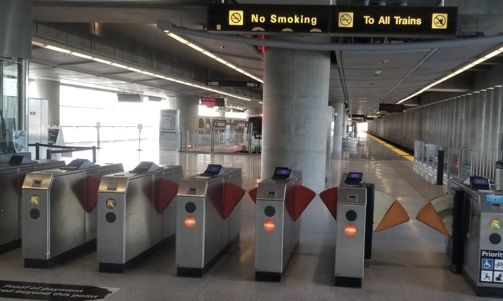 a group of turnstiles in a train station