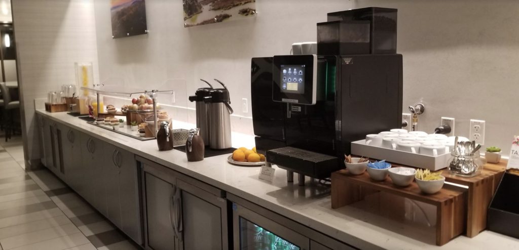 a coffee machine and coffee maker on a counter