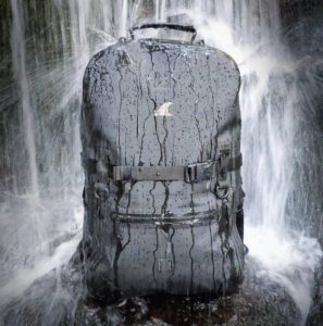 a backpack in a waterfall