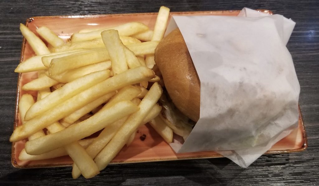 a burger and fries on a plate