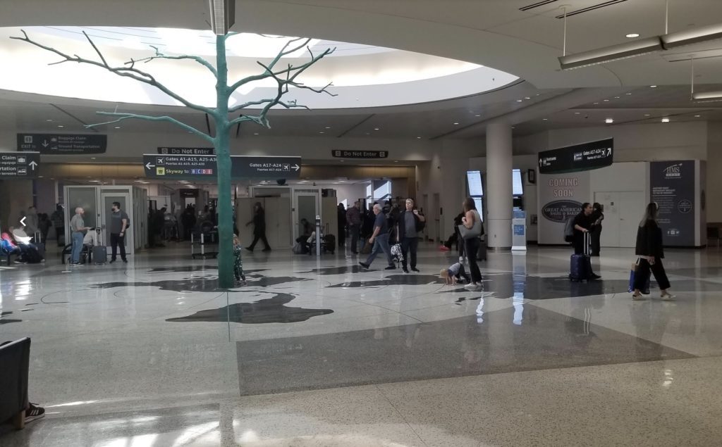 a group of people in a large airport