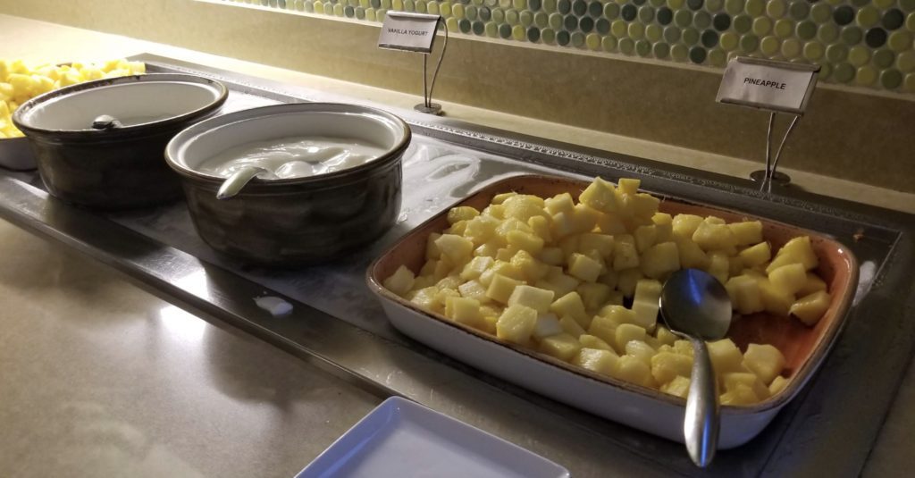 food in a pan with a spoon