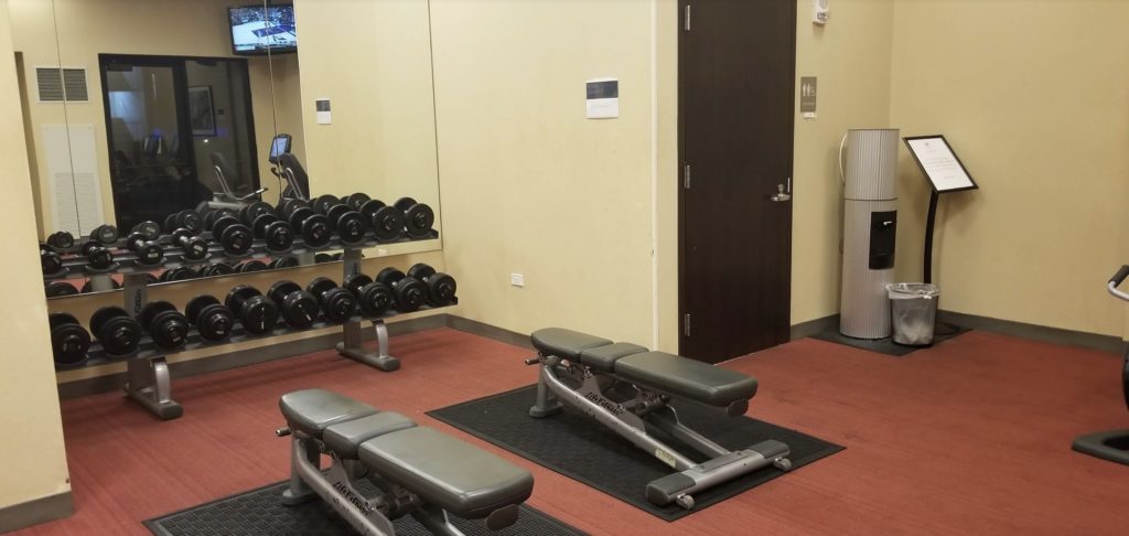 a room with weights and a door