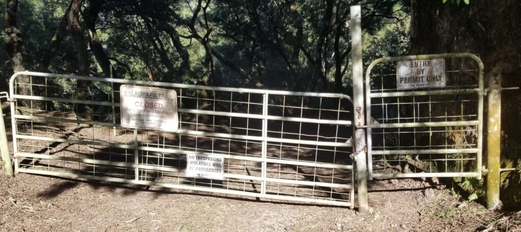 a gate with a sign on it