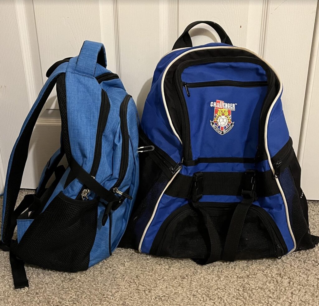 a blue backpack next to a blue backpack