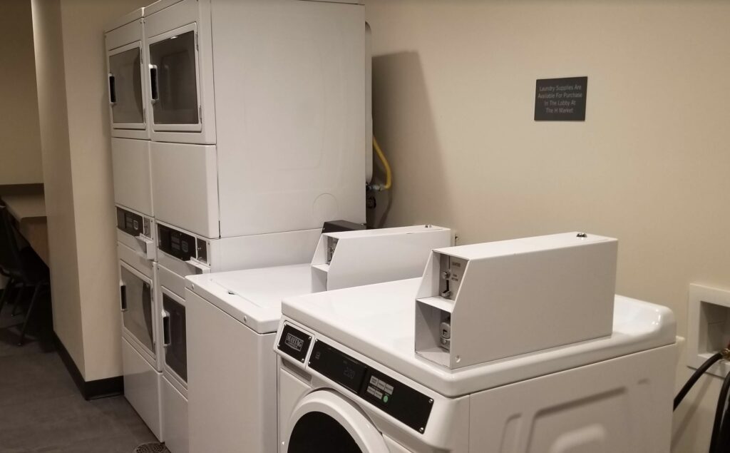a stack of white washing machines