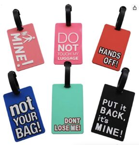 a group of luggage tags with text