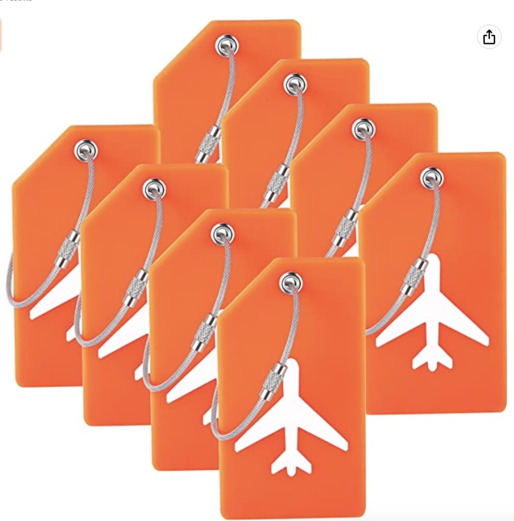 a group of orange tags with a white airplane on it