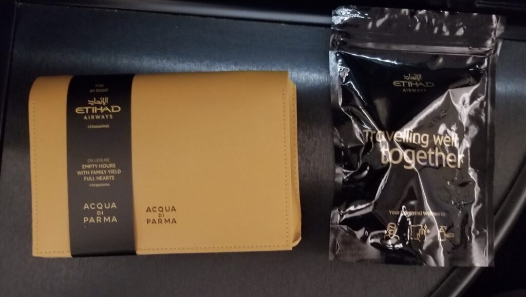 a brown wallet next to a black bag