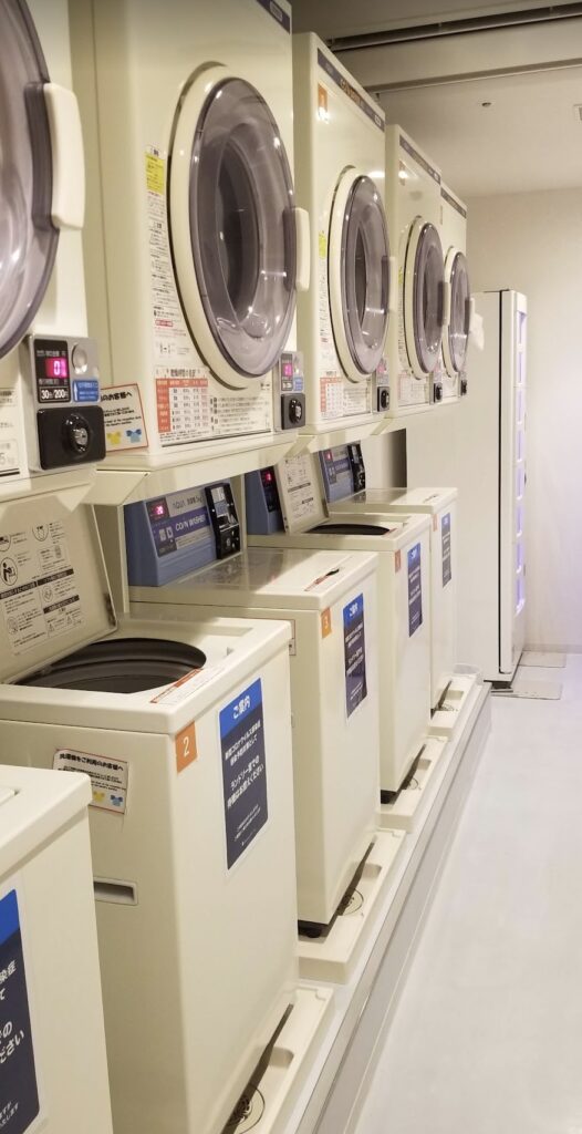 a row of white washing machines