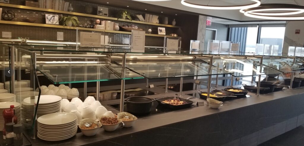 a buffet line with food on the counter