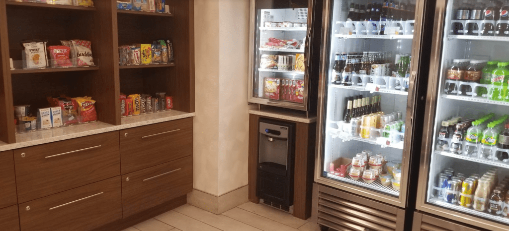 a refrigerator with drinks and beverages in it