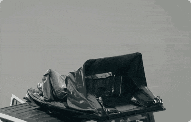 a black and white image of a person lying in a boat