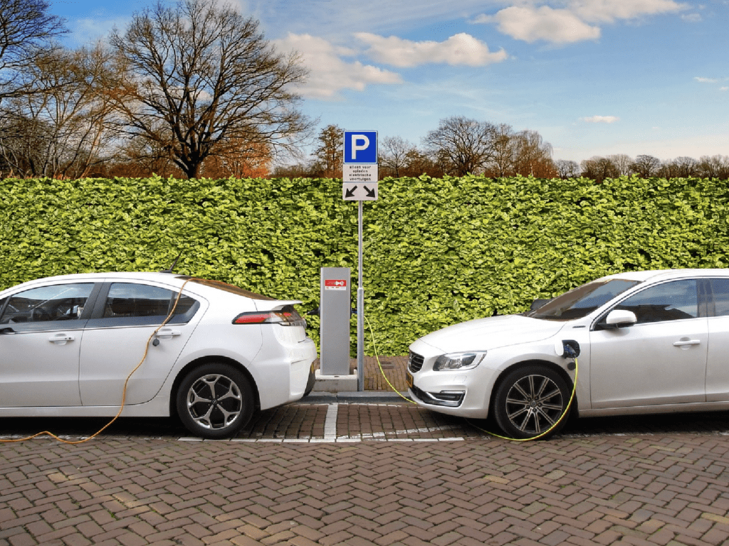 two cars charging at a charging station