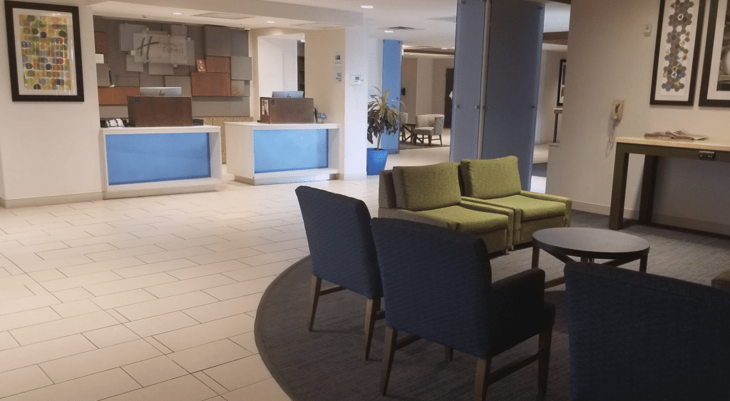 a lobby with chairs and tables