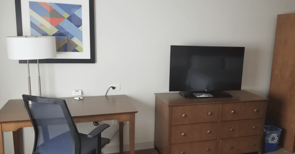 a desk and a tv in a room