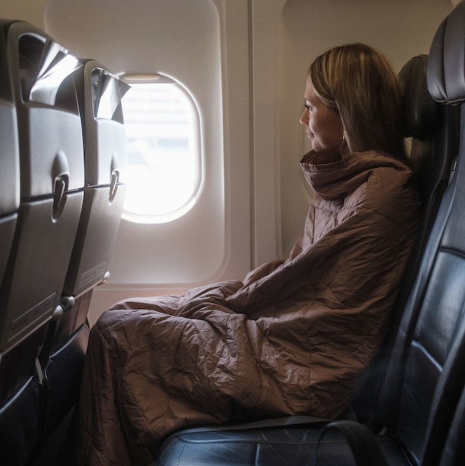 a woman sitting in a plane