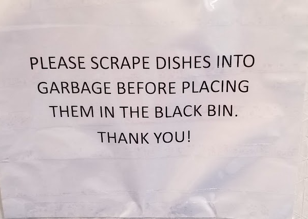 a white plastic bag with black text