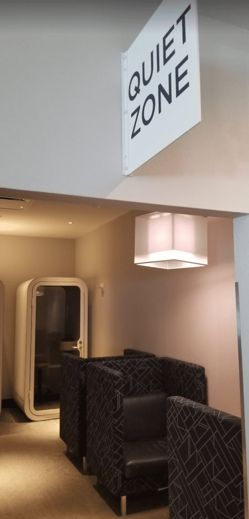 a room with a light fixture and a chair
