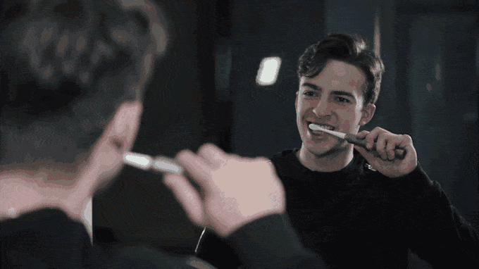 a man brushing his teeth