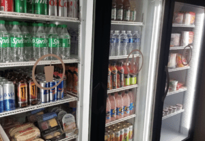 a refrigerator with drinks and beverages