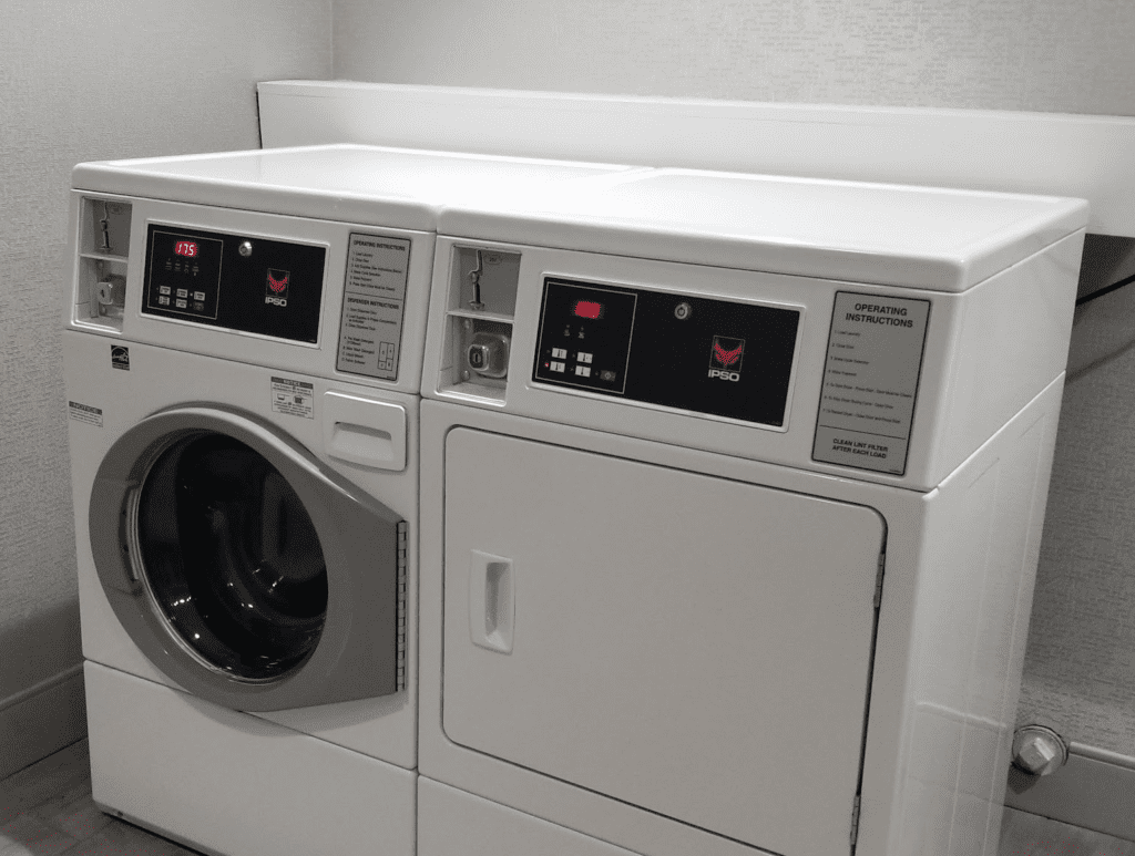 a washing machine and dryer in a room