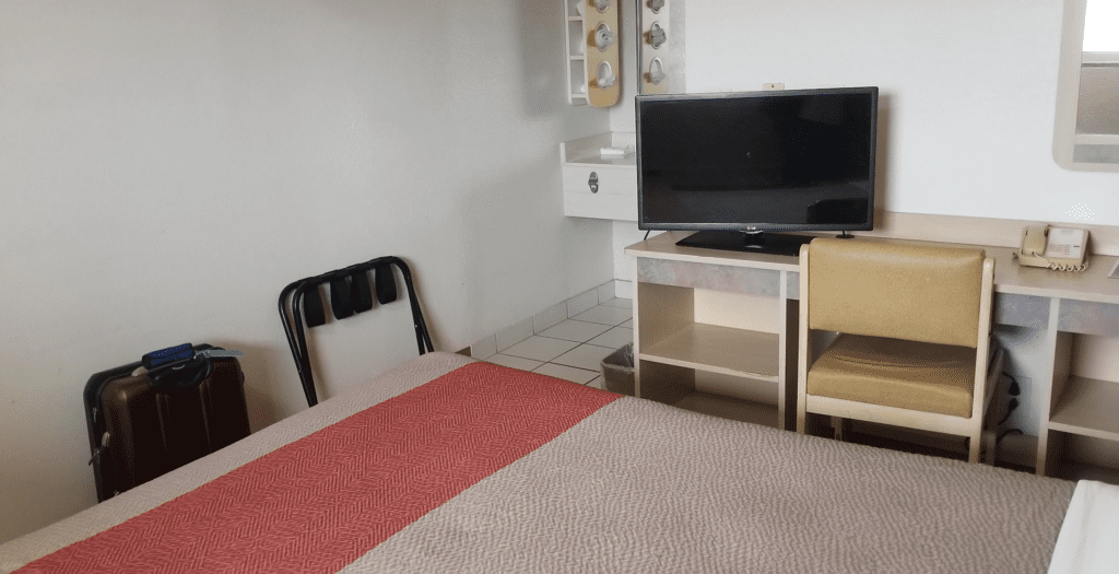 a bed with a tv on it