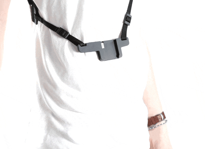 a person wearing a camera strap