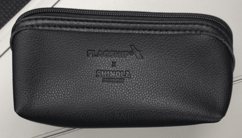 a black zippered bag with text on it
