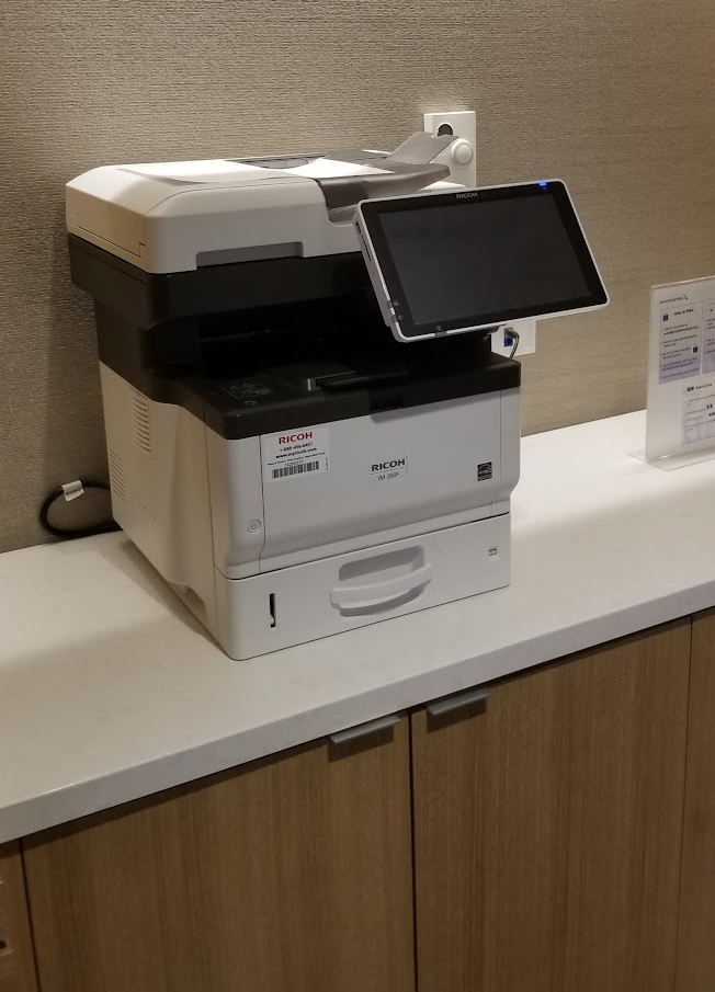 a printer with a screen on top of it