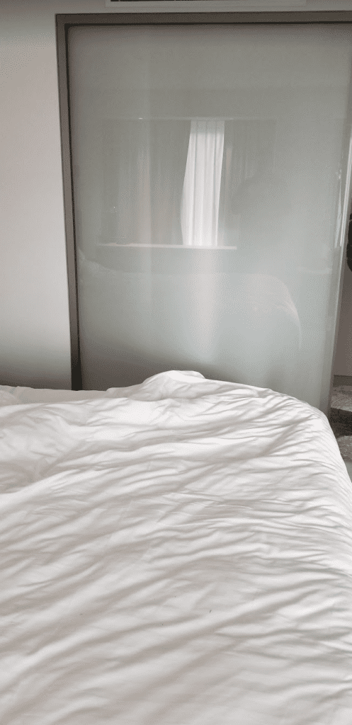 a bed with a white sheet