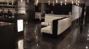 a group of people sitting at tables in a restaurant