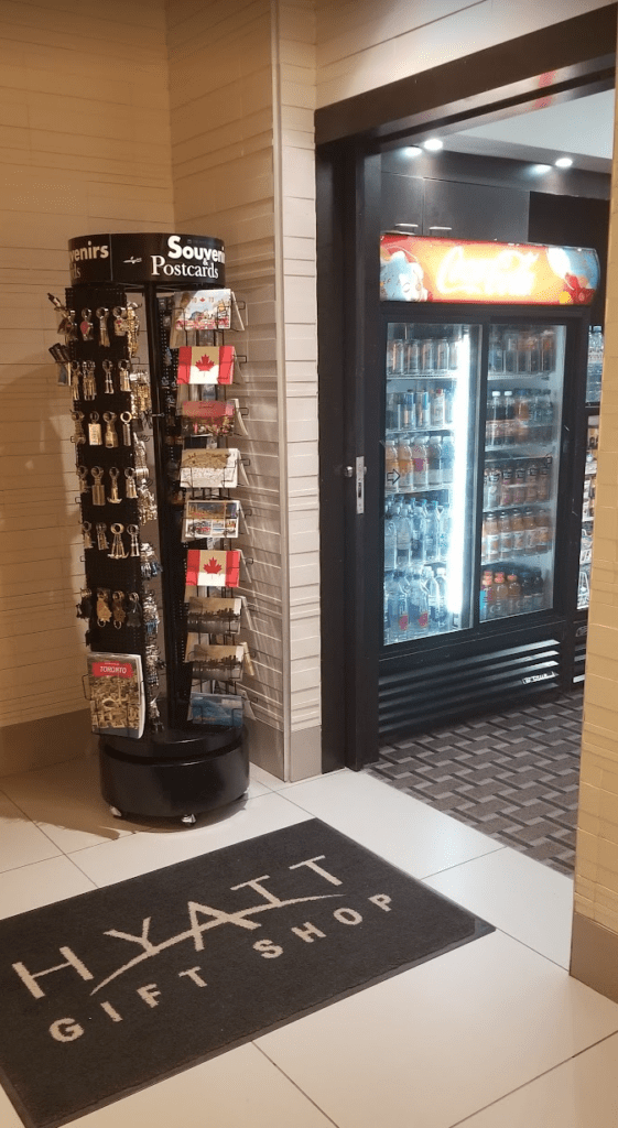 a display case with keychains and drinks