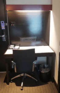 a chair and desk in a room