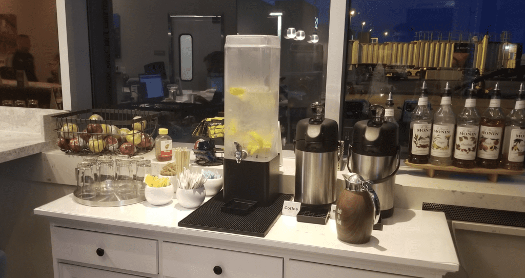 a water dispenser with lemons on a counter
