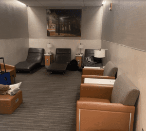 a room with chairs and a picture on the wall