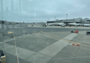 an airport with a lot of vehicles parked on the ground